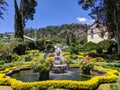 Nuwara Eliya, Sri Lanka - March 10, 2022: View of the territory of the Grand Hotel with landscaping. Jets of water pour from the