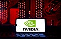 Nvidia logo on a smartphone screen with electronic components in the background. Royalty Free Stock Photo