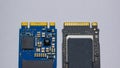 NVME M2 SSD disks for data storage at high speed closeup on isolated background. Comparision view focused at the pinpoint.