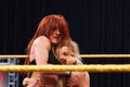 NXT Female wrestlers Becky Lynch puts Carmella in headlock in ri Royalty Free Stock Photo