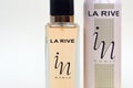 La rive IN woman deodorant and perfume bottles on beige background. LA RIVE S.A. is one of the leading producers of perfumes and Royalty Free Stock Photo