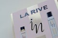 La rive IN woman deodorant and perfume bottles in brand box on beige background. LA RIVE S.A. is one of the leading producers of Royalty Free Stock Photo