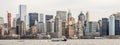 A NY Waterway Cruise Boat with Manhattan Skyscrapers and Towers in Background, Lower Manhattan, New York City