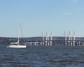 Nyack, NY / United States - Nov. 4, 2019: Landscape image of the Tappan Zee Bridge and a Sailboat on the Hudson River