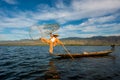 Intha fisherman posing with conical net at Inle Lake in the Nyaungshwe Township part of Shan Hills in Myanmar Royalty Free Stock Photo