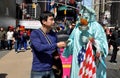 NYC: Asian Tourist Tipping Statue of Liberty Mime