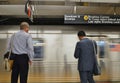 NYC Business Men Waiting for the Train on Subway Platform MTA New York City Work Commute Royalty Free Stock Photo