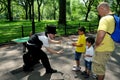 NYC: Children Watching a Magician Royalty Free Stock Photo