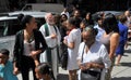 NYC: Priest Greeting Parishioners