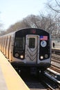 NYC Subway Q Train arrives at Avenue M Station in Brooklyn Royalty Free Stock Photo