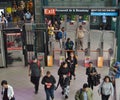 NYC Subway Queens New York MTA Station People Traveling and Entering Turnstile Royalty Free Stock Photo