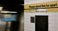 NYC Subway Sign Reminding People about Social distancing and Standing Apart Six Feet New York