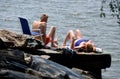 NYC: Sunbathers by Hudson River Royalty Free Stock Photo