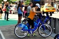 NYC: Woman with Citibike at Docking Station