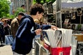 NYC: Young Man Browsing Artwork