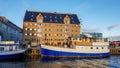 Nyhavn waterfront, canal, colorful facades of old house reflection, and buildings, ships, yachts and boats in Copenhagen, Denmark Royalty Free Stock Photo