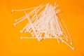 nylon cable ties in glass in jar in bucket on orange background