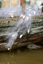 Nylon fishing net hanging from the boat