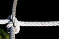 Nylon Rope Knot four ways, difficult hard to solve, black background Royalty Free Stock Photo