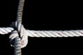 Nylon Rope Knot four ways, difficult hard to solve, black background Royalty Free Stock Photo