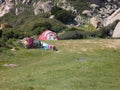 Nylon tent erected for camping vacation in isolated meadow, Sardinia, Italy