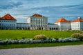 Nymphenburg palace with garden lawn in front in Munich. Royalty Free Stock Photo