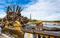 Nymphs of the seine gilded statue on the Alexander III Bridge with the Eiffel Tower in the background in Paris Royalty Free Stock Photo