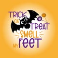 Trick or treat smell my feet funny halloween text, with bat and candy on orange background. Royalty Free Stock Photo