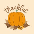 Thankful - thanksgiving text, with Pumpkin and leaves on beige background.