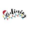 Believing - Christmas calligraphy with Santa`s hat and christmas lights