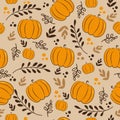 Autumnal seamless pattern - pumpkins and leaves, on beige background.