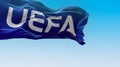 Nyon, CH, September 2022: flag with the UEFA logo waving in the wind. UEFA is the association that manages professional football