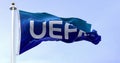 Nyon, CH, September 2022: flag with the UEFA logo waving in the wind. UEFA is the association that manages professional football