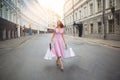 Fashionably dressed woman on the streets of a small town, shopping concept