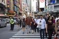 NYPD agent directs people and traffic on busy NYC street