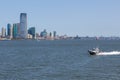 NYPD boat patrolling East River. In the background skyscrapers New Jersey. Royalty Free Stock Photo