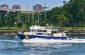 A NYPD Harbor Unit Police Boat patrols in the East River near Randall`s Island, NYC Royalty Free Stock Photo