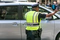 NYPD officer directing traffic in Manhattan