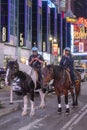 New York City, USA - June 7, 2017: NYPD police officers on horseback in Times Square, New York City. Mounted Police patrolling the Royalty Free Stock Photo