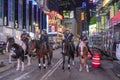 NYPD police officers on horseback in Times Square, New York City. Mounted Police patrolling the night in Times Square Royalty Free Stock Photo