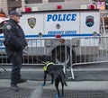 NYPD transit bureau K-9 police officer and K-9 dog providing security on Times Square during Super Bowl XLVIII week in Manhattan Royalty Free Stock Photo