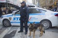 NYPD transit bureau K-9 police officer and K-9 German Shepherd providing security on Broadway during Super Bowl XLVIII week Royalty Free Stock Photo