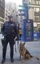NYPD transit bureau K-9 police officer and K-9 German Shepherd providing security on Broadway during Super Bowl XLVIII week Royalty Free Stock Photo
