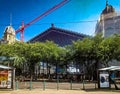 Nyugati palyaudvar railway station building among tall trees in the center of Budapest Royalty Free Stock Photo