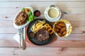 New Zealand ribeye steak, mushroom soup, BBQ chicken wings and chicken chop salad on family table Royalty Free Stock Photo