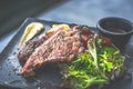 NZ ribeye steak, pan seared to medium rare, accompanied with real country creamy mashed potato, cherry tomatoes on vine, garden Royalty Free Stock Photo