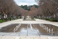 Nimes, Occitanie, France - Fountains and trees at the pedestrian zone of the Avenue Jean Jaures