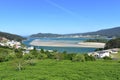 Bay with small fishing village and coastal river. O Barqueiro, A Coruna Province, Spain. Royalty Free Stock Photo