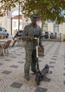 The `O Cauteleiro`, a bronze statue of a lottery ticket seller in Lisbon, Portugal.