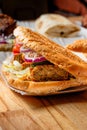 Kebab with falafel, vegetables and sauce in a bun isolated for menu Royalty Free Stock Photo